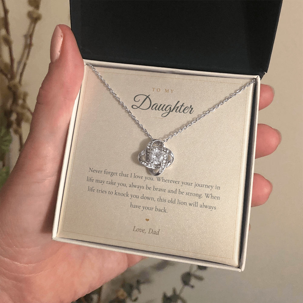 Gold love knot daughter necklace presented in an open mahogany gift box
