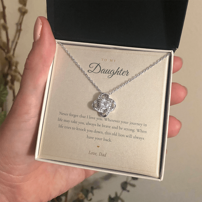 Gold love knot daughter necklace presented in an open mahogany gift box