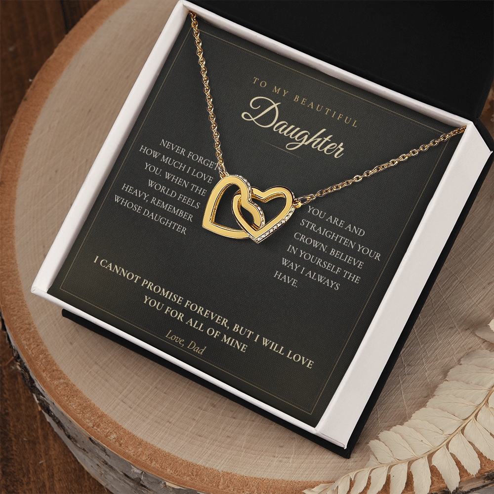 Daughter message card and hearts necklace in a white gift box on a wooden table