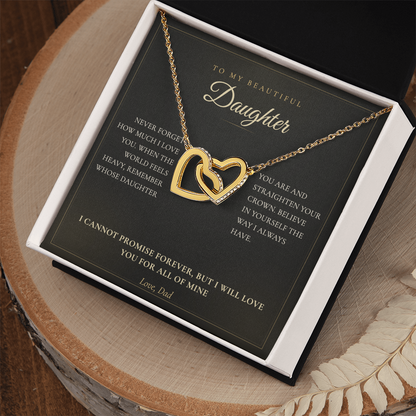 Daughter message card and hearts necklace in a white gift box on a wooden table