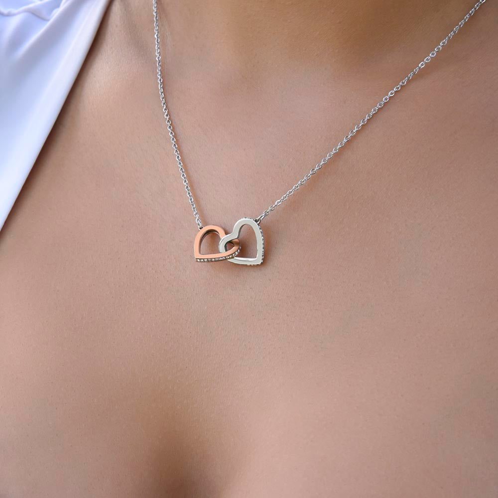 Silver interlocking hearts daughter necklace in an open mahogany LED gift box